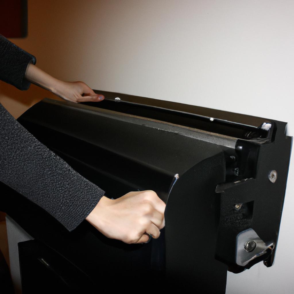 Person holding a printing press