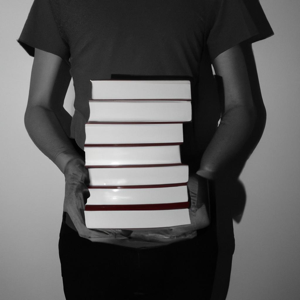 Person holding stack of books