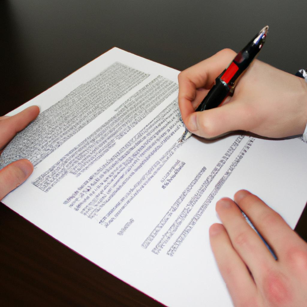 Person signing publishing contract document